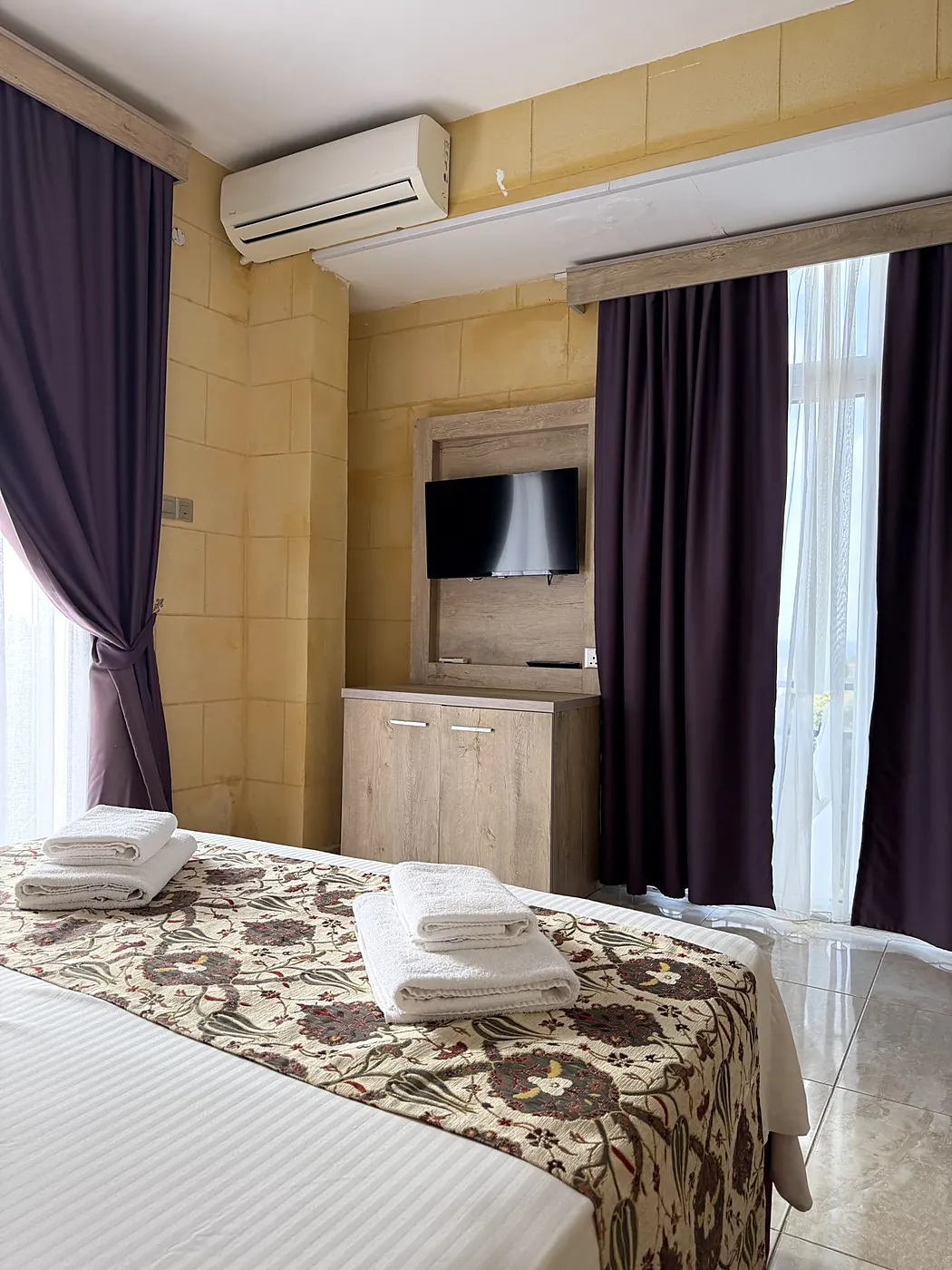 Double room with a stone wall at Lapida Garden Hotel, Lapta